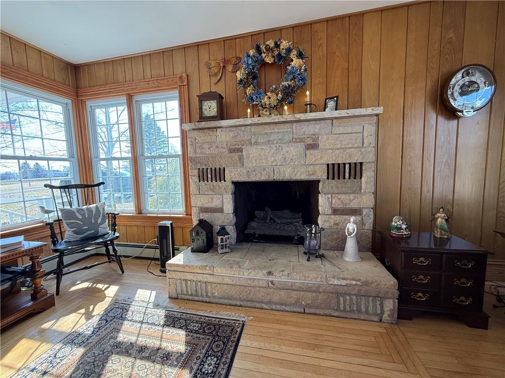 172 Valley Road Cranberry, PA 16319 - Photo 19 of 50 a living room with furniture a fireplace and a floor to ceiling window