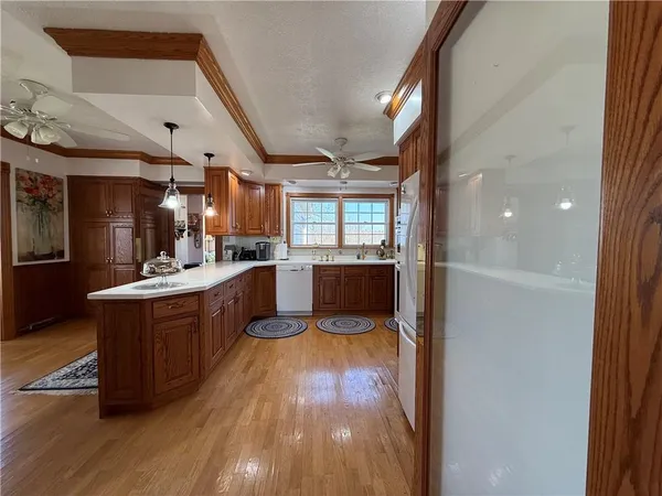 a kitchen with stainless steel appliances a refrigerator and a stove