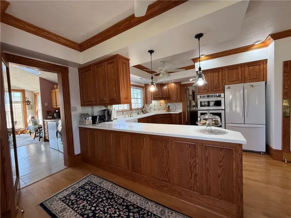 a kitchen with a sink stove and cabinets