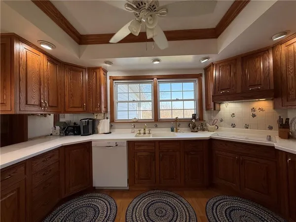 a kitchen with stainless steel appliances granite countertop a sink and cabinets