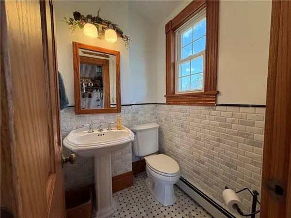 a very nice looking room with a large window and furniture