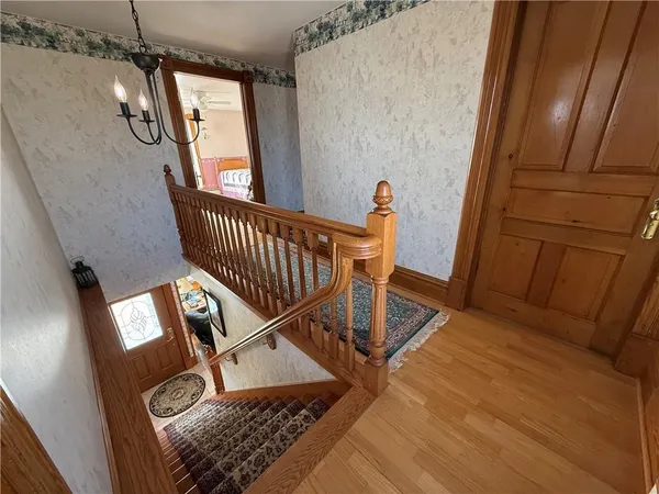 a bedroom with a bed couch and a window