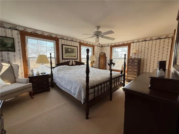 a bedroom with a bed and window