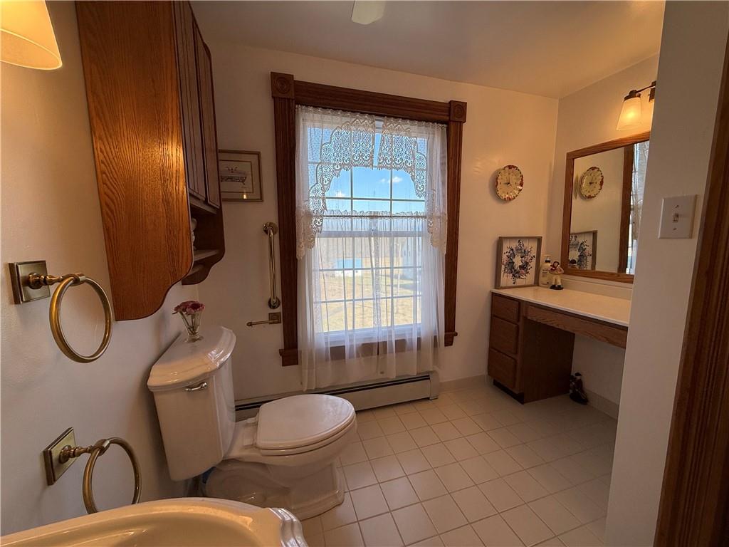 172 Valley Road Cranberry, PA 16319 - Photo 33 of 50 a bathroom with a toilet a sink and mirror