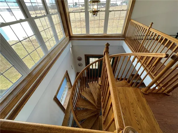 a view of a room with furniture wooden floor and window
