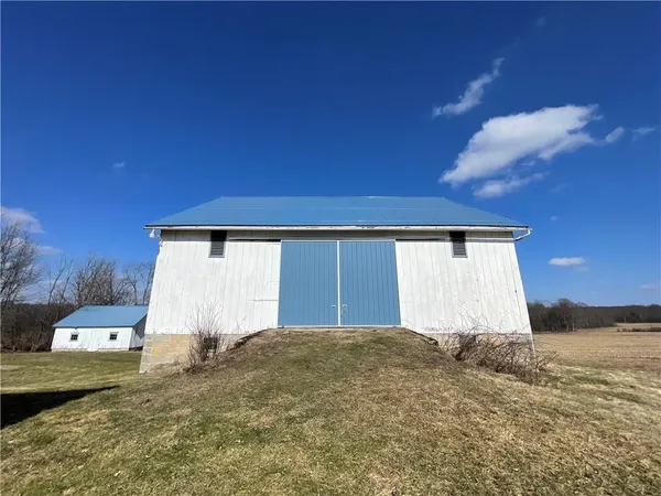 a view of a big house with a yard