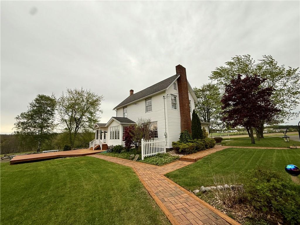 172 Valley Road Cranberry, PA 16319 - Photo 7 of 50 a front view of a house with garden