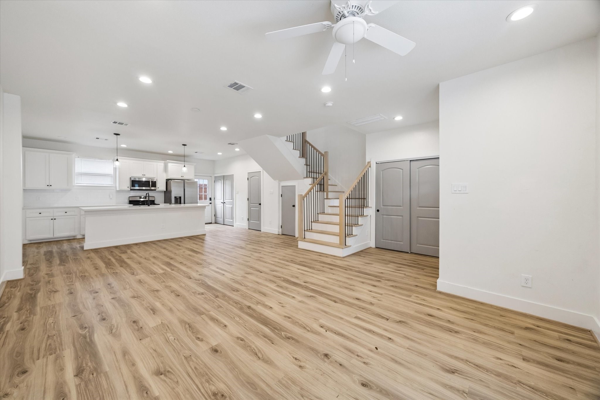 2749 Redrock Street, Unit B Houston, TX 77088 - Photo 4 of 24 Featuring neutral paint and a seamless flow, the living room/dining room cohesively offer plenty of space.