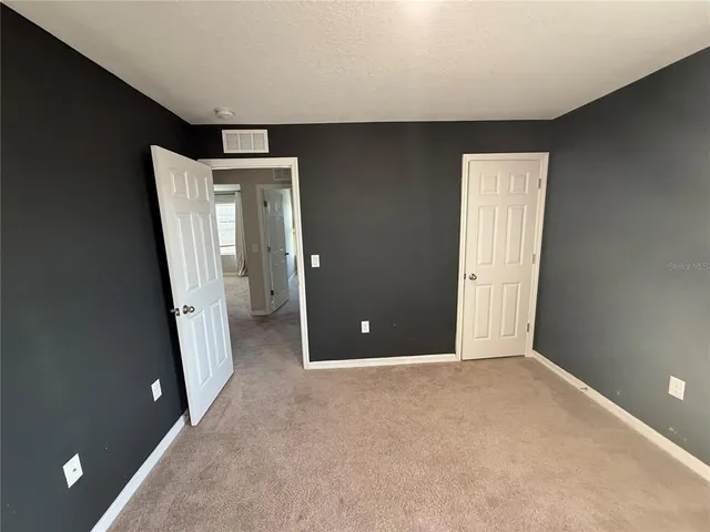 an empty room with a mirror