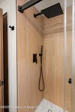 a view of a patio with couches table and chairs with potted plants and large trees