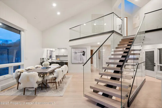 a view of dining room and workspace with furniture