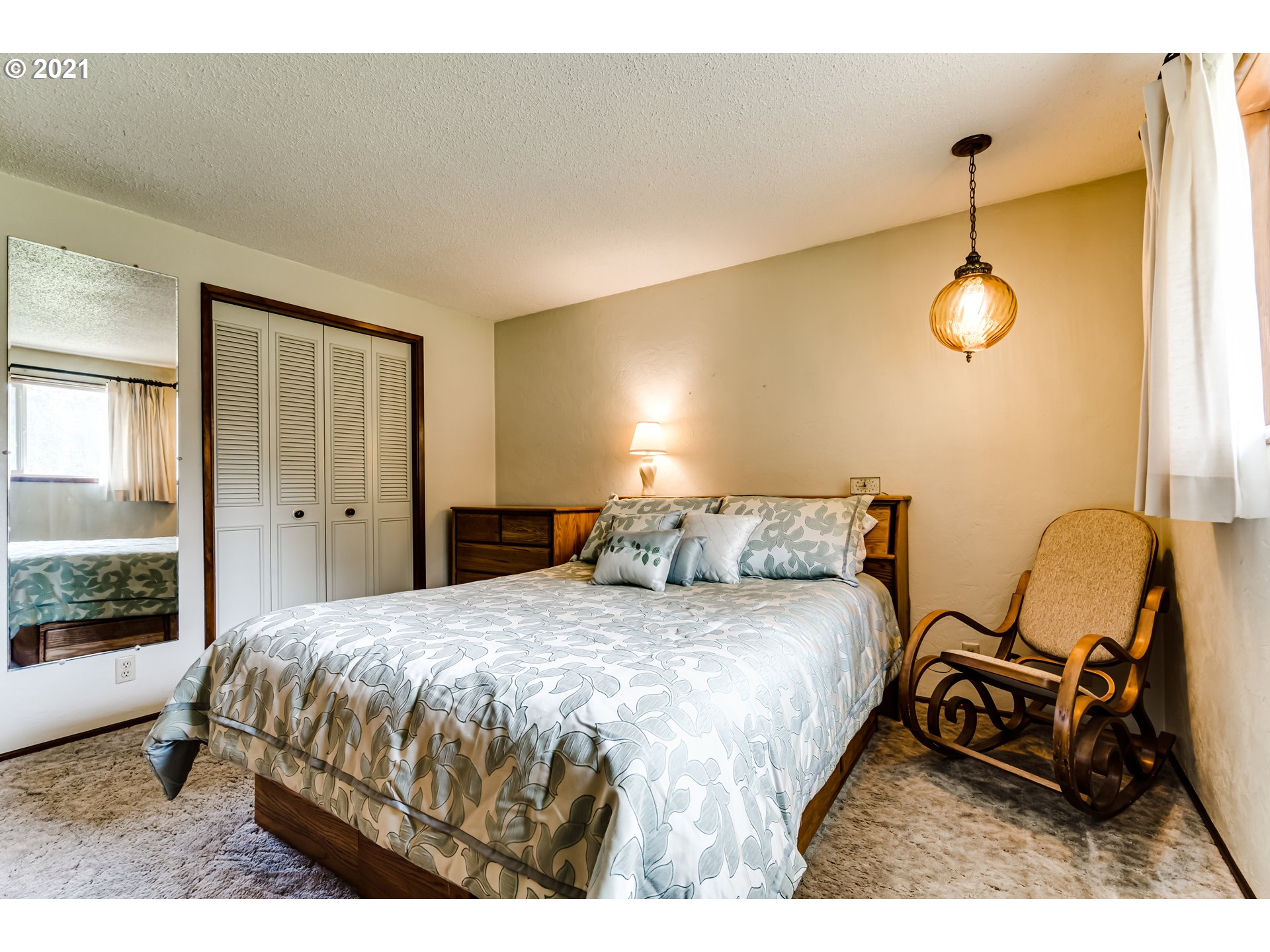 37771 Camp Creek Road Springfield, OR 97478 - Photo 16 of 30 a bedroom with a bed a chair and a large window