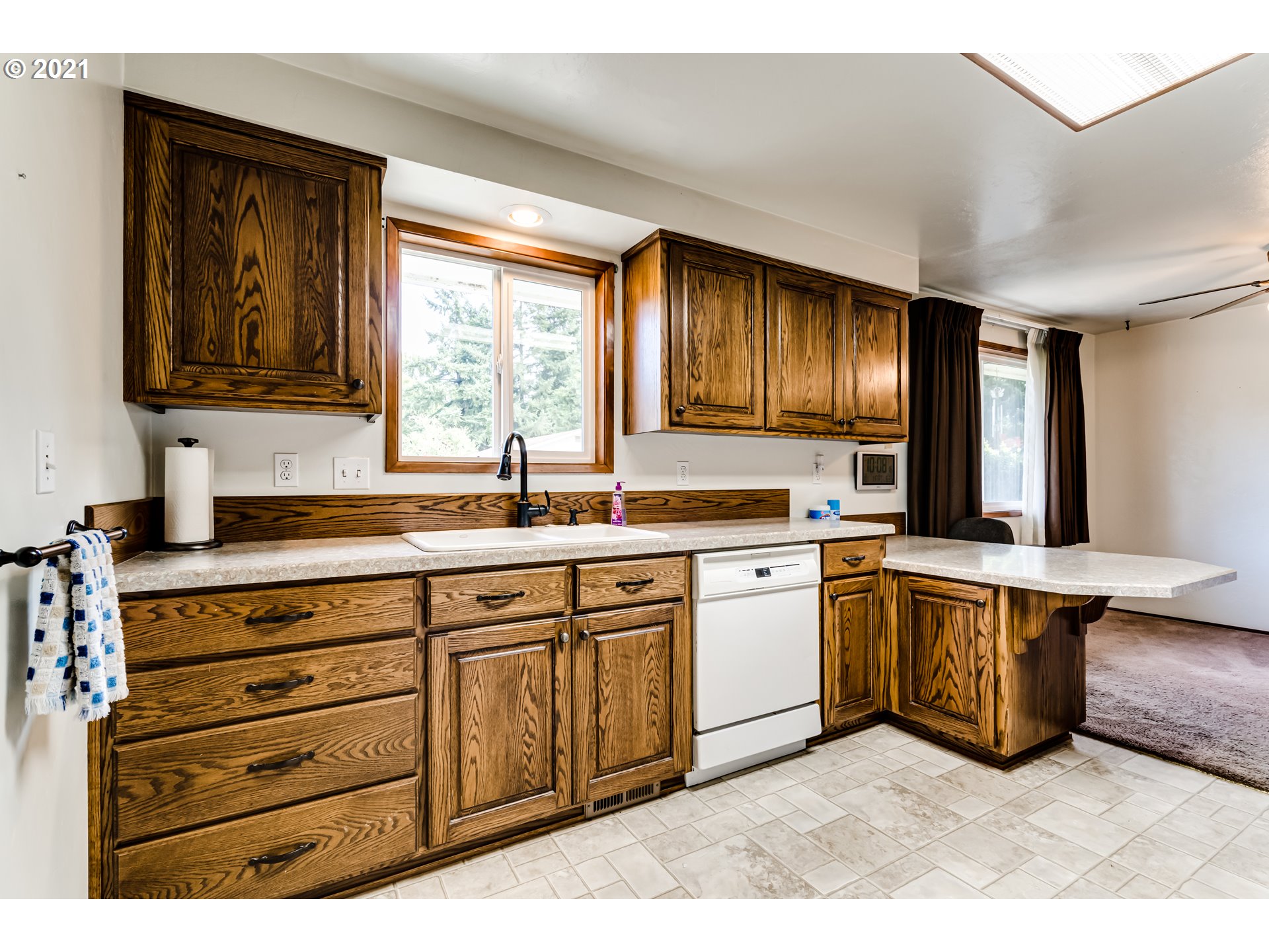 37771 Camp Creek Road Springfield, OR 97478 - Photo 9 of 30 a kitchen with stainless steel appliances granite countertop a sink dishwasher stove and cabinets with wooden floor