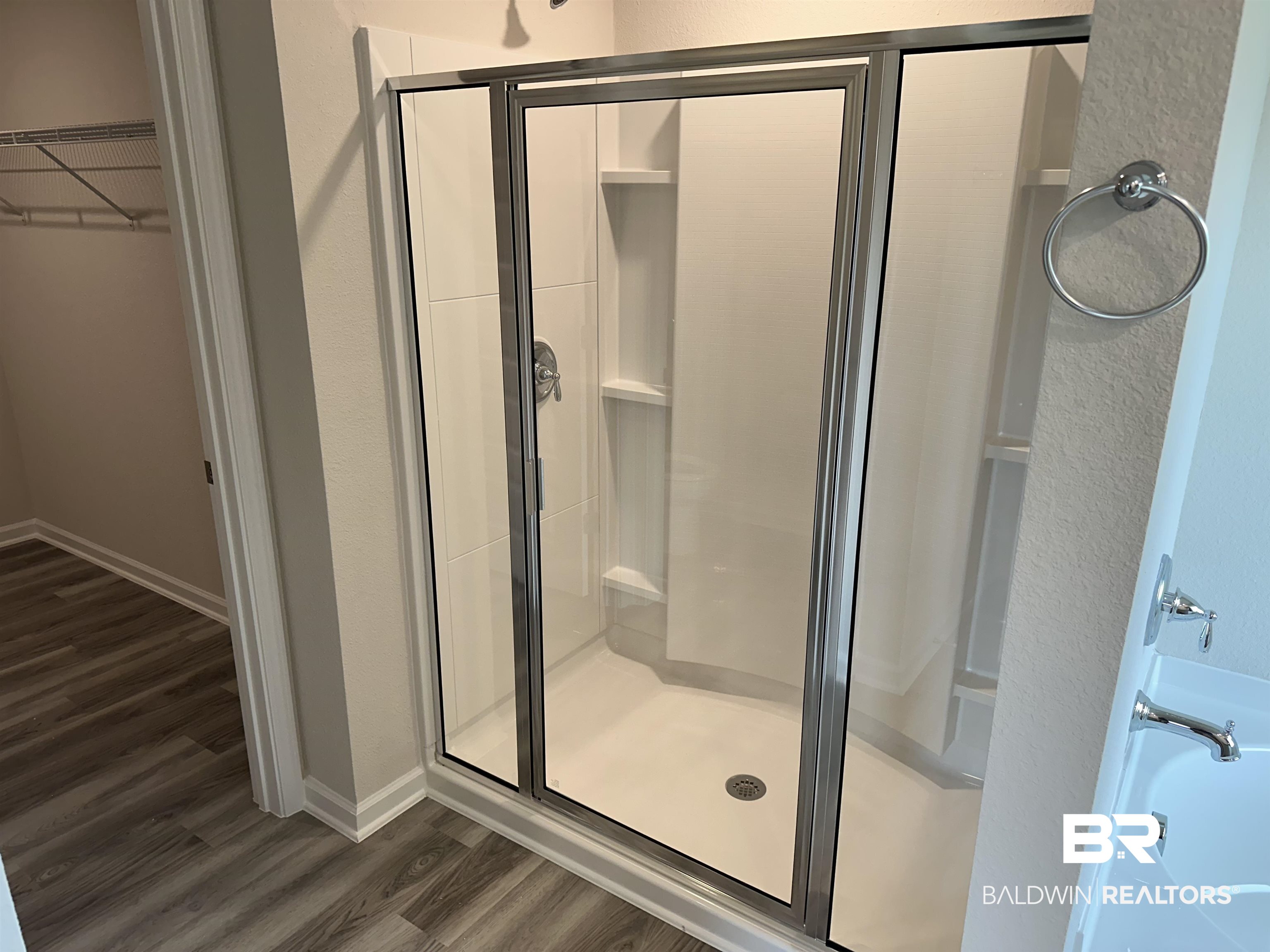1238 Hayward Loop Foley, AL 36535 - Photo 33 of 46 Bathroom featuring wood-type flooring and a shower with shower door