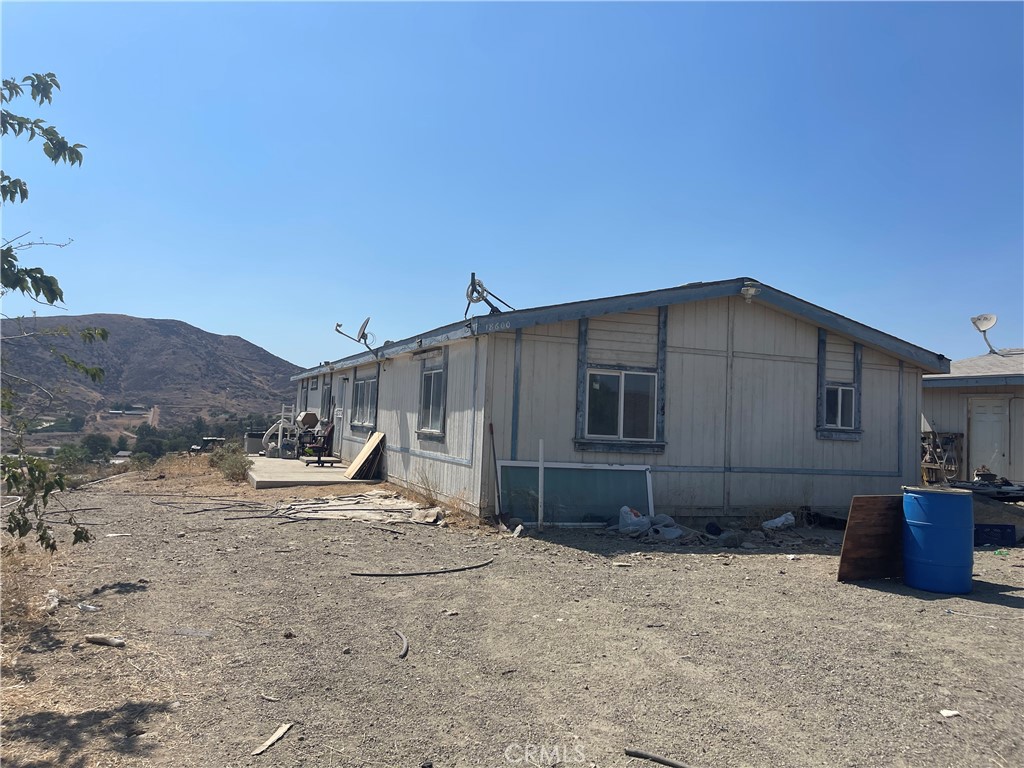 18600 Chippewa Road Lake Elsinore, CA 92532 - Photo 1 of 18 a front view of a house with a yard