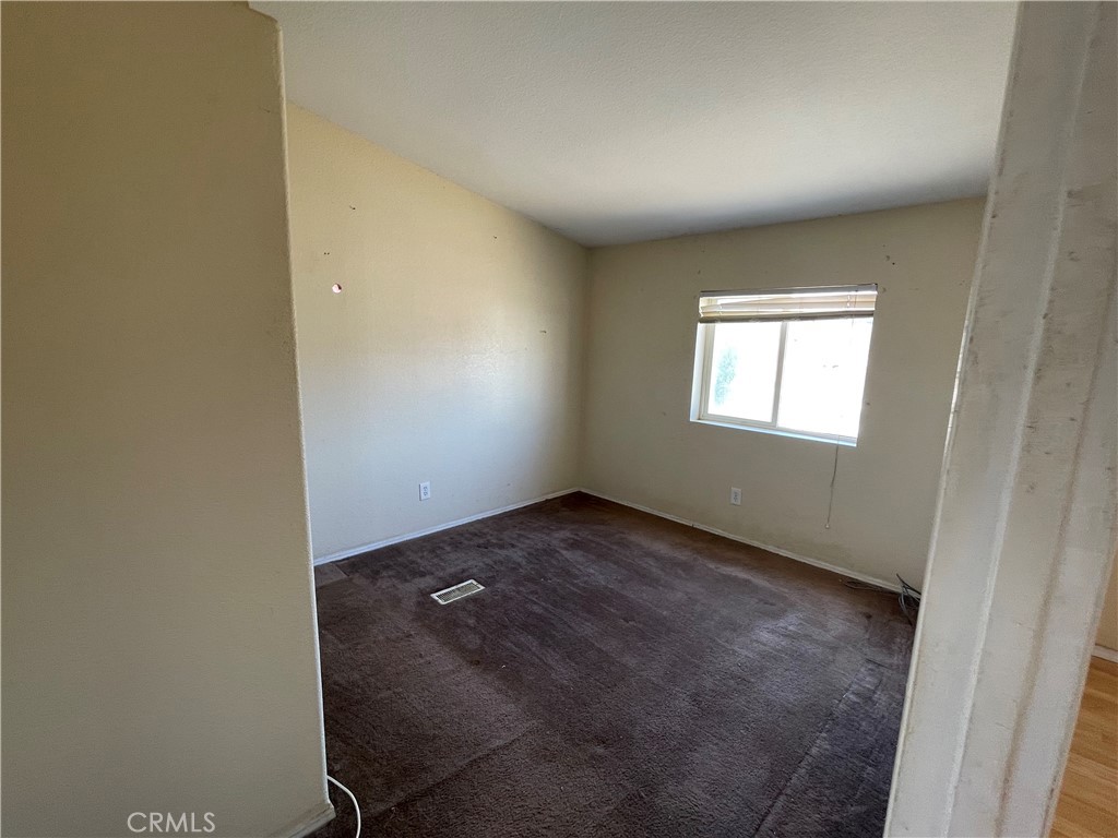 18600 Chippewa Road Lake Elsinore, CA 92532 - Photo 13 of 18 an empty room with windows