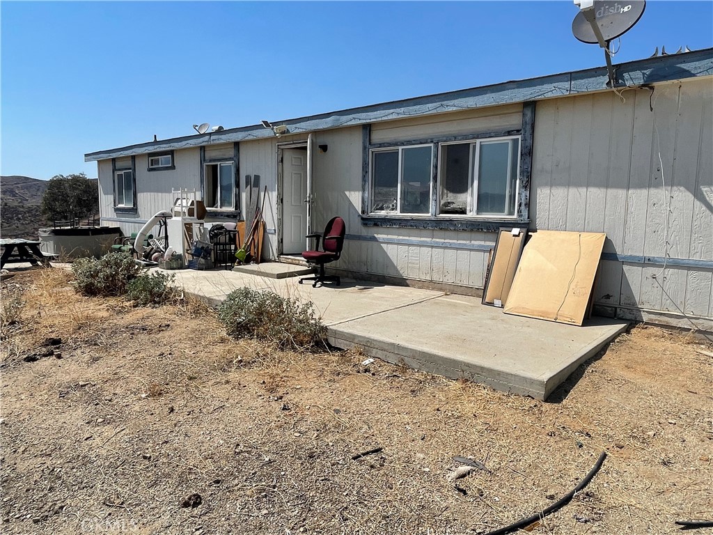 18600 Chippewa Road Lake Elsinore, CA 92532 - Photo 8 of 18 a view of a house with a patio