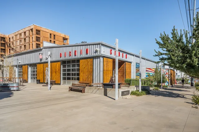 a view of a building with sitting area