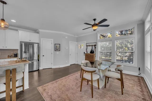 a workspace with wooden floor and a livingroom view