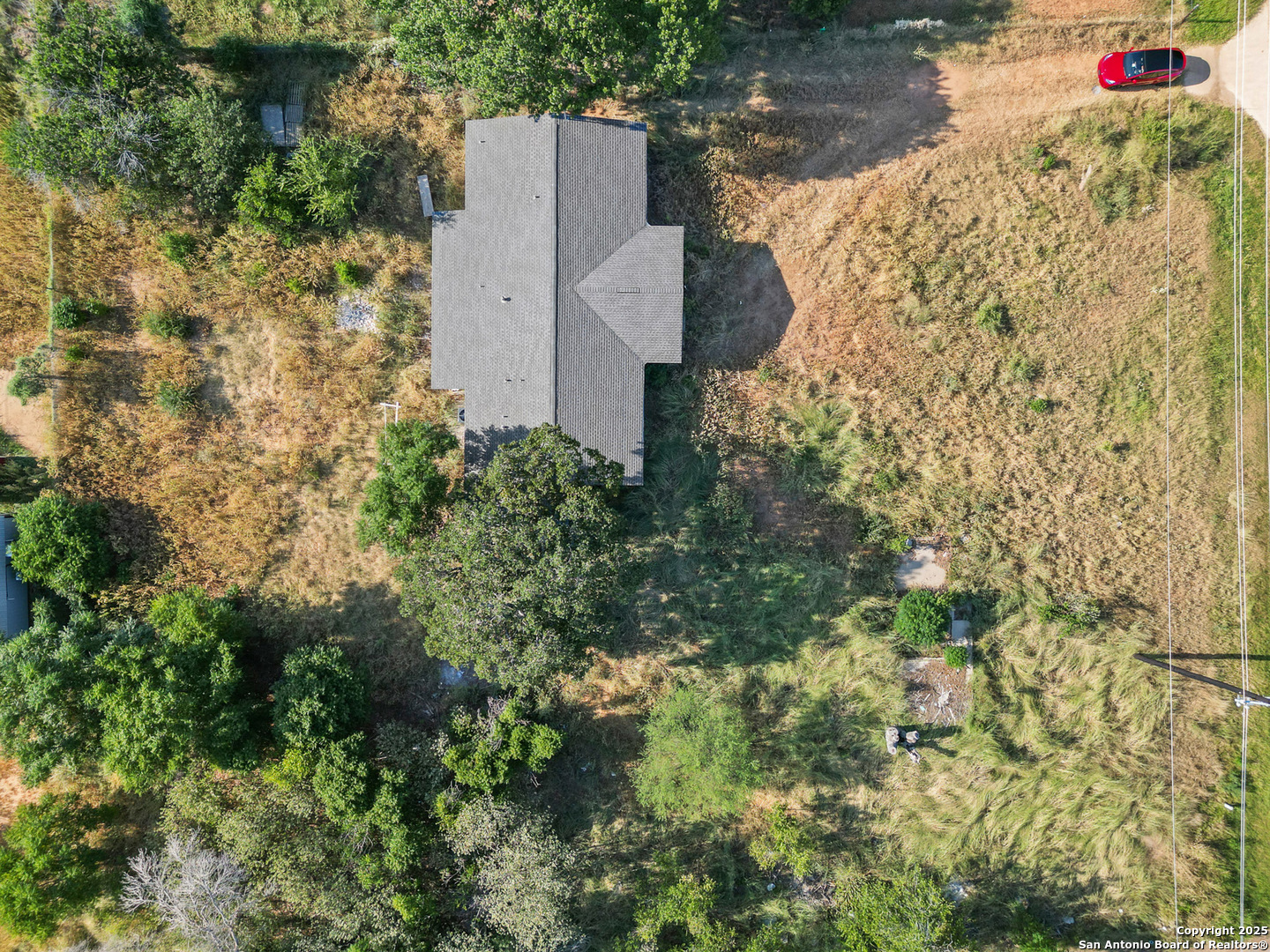 19551 Farm To Market Road 463 Devine, TX 78016 - Photo 25 of 27 an aerial view of a house with a yard