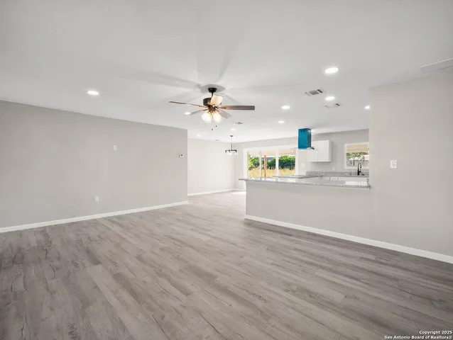a view of a kitchen with a sink and cabinet