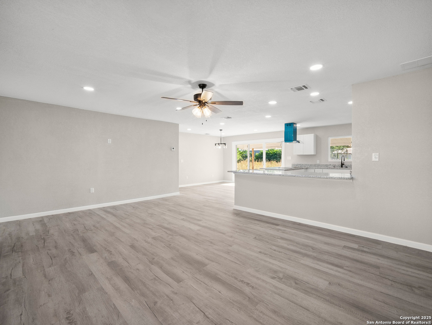 19551 Farm To Market Road 463 Devine, TX 78016 - Photo 3 of 27 a view of a kitchen with a sink and cabinet