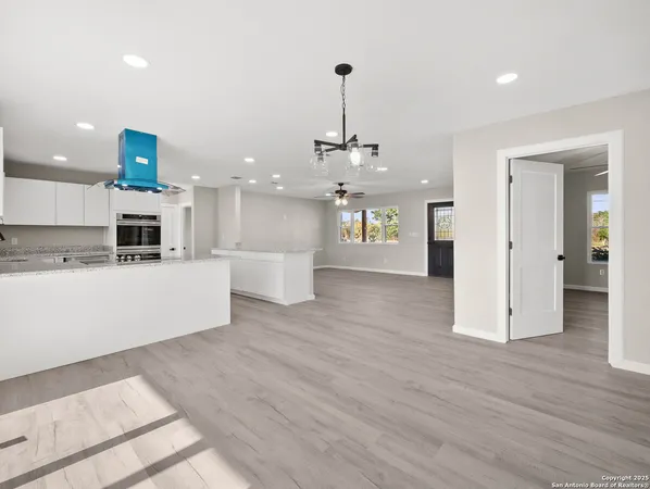 a view of a kitchen with a sink stainless steel appliances and cabinets