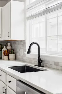 a kitchen with a sink and a window