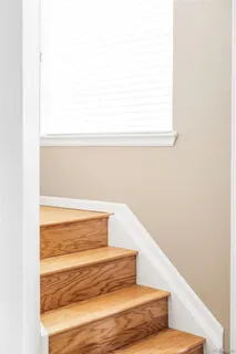 a bedroom with a bed and flat screen tv