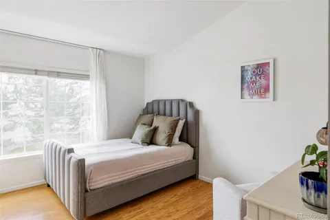 a bathroom with a sink vanity mirror and toilet