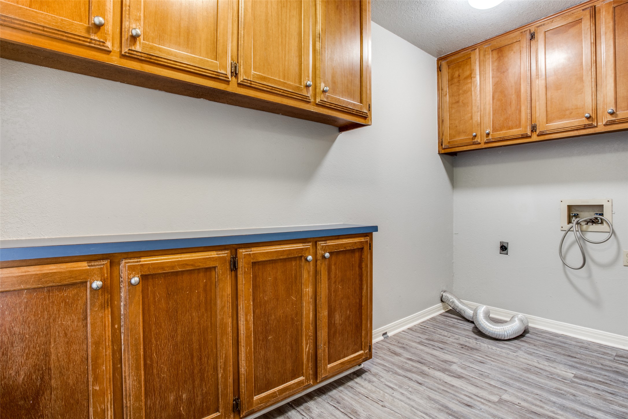 106 Verna Spur, Unit B Georgetown, TX 78628 - Photo 22 of 25 Ample cabinetry provides generous storage in this functional utility space.