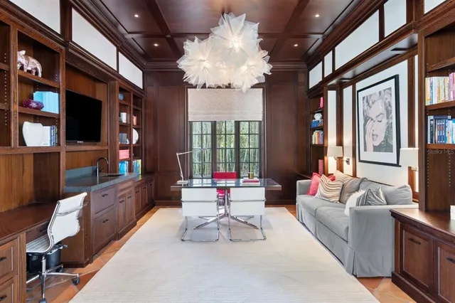 a bathroom with a granite countertop sink a toilet and a mirror
