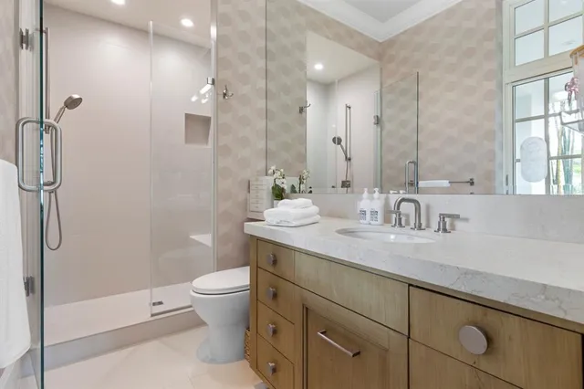 a bed room with a bed and a large window