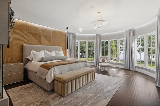 a large bathroom with a granite countertop sink mirror and bathtub