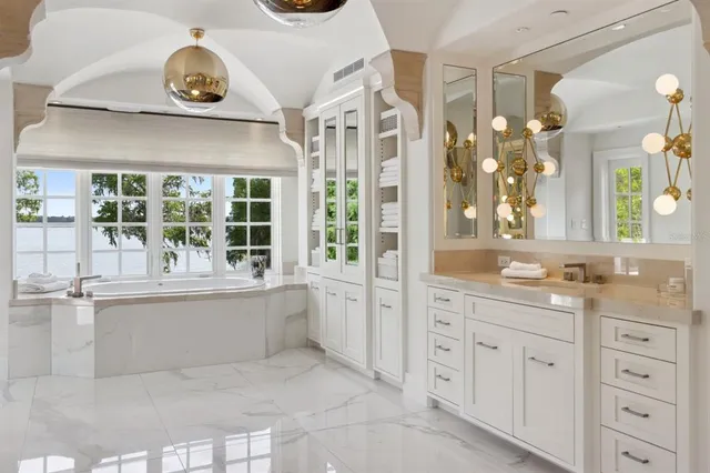 a view of a patio with swimming pool and sitting area