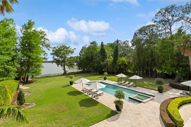 a view of swimming pool with lounge chair