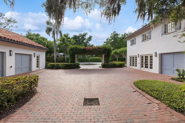a kitchen with a table chairs refrigerator and microwave