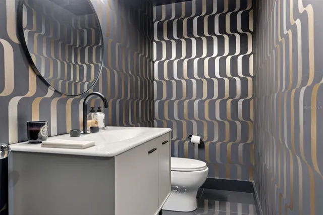 a aerial view of a house with swimming pool and a yard