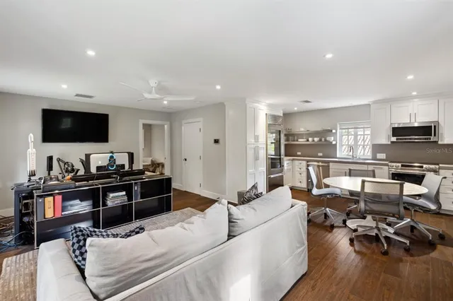 an aerial view of a house with swimming pool and outdoor space