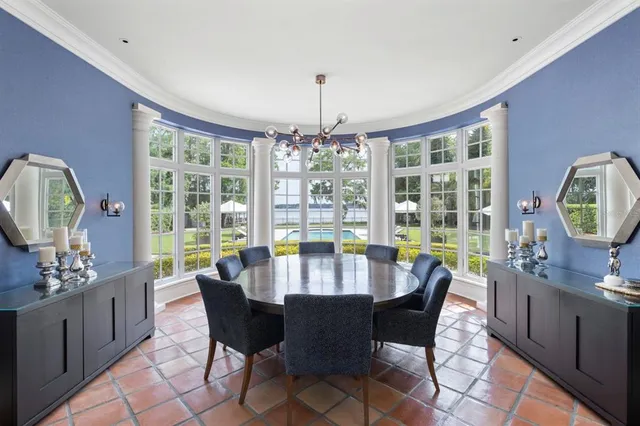 a large white kitchen with a stove top oven a sink and dishwasher
