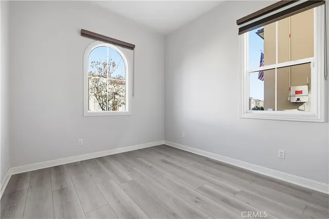 a view of room with window and hardwood floor