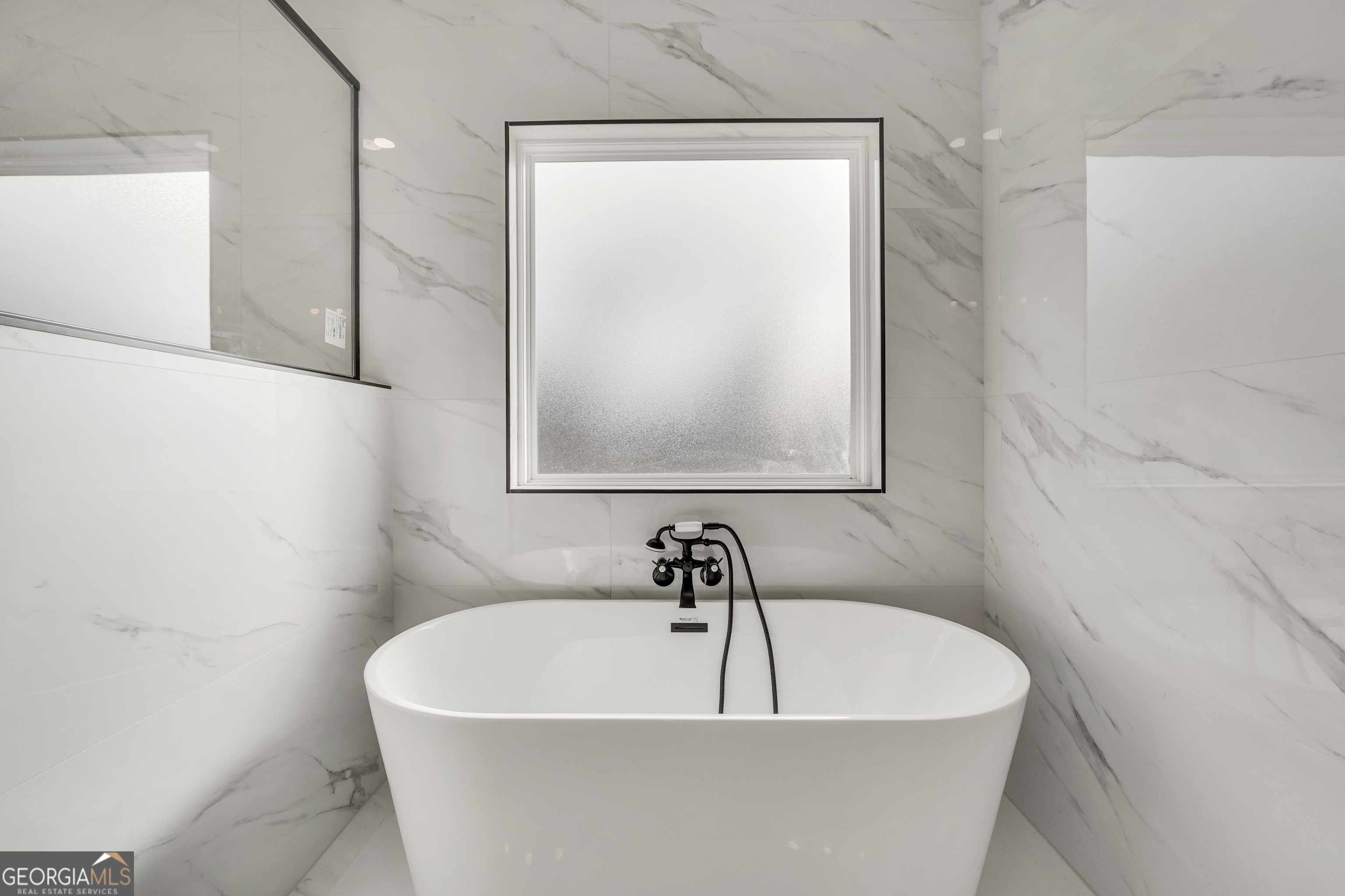 267 East Knight Road McDonough, GA 30252 - Photo 11 of 17 a white bath tub sitting in a bathroom