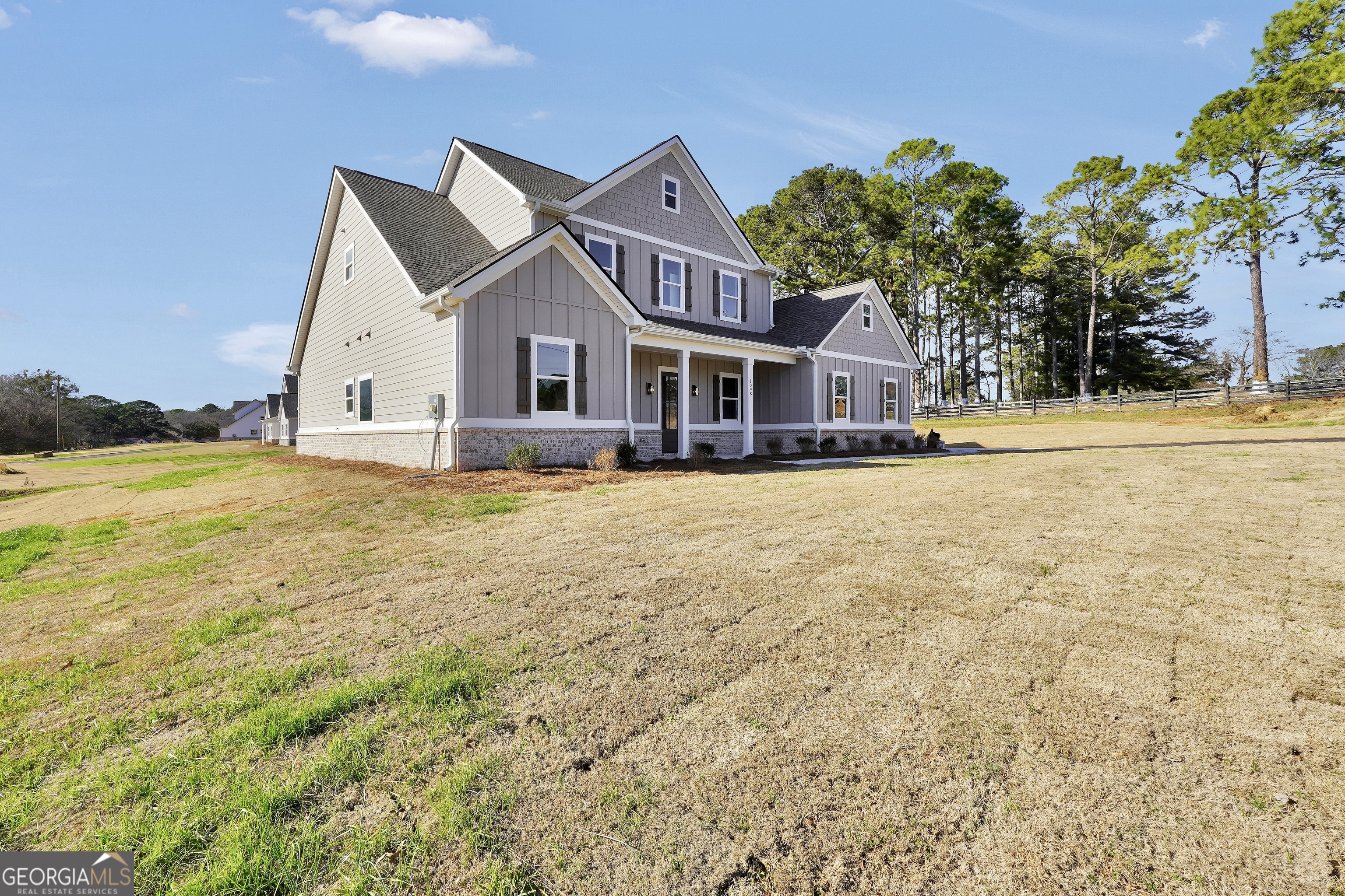 267 East Knight Road McDonough, GA 30252 - Photo 3 of 17 a front view of residential houses with yard and ocean view