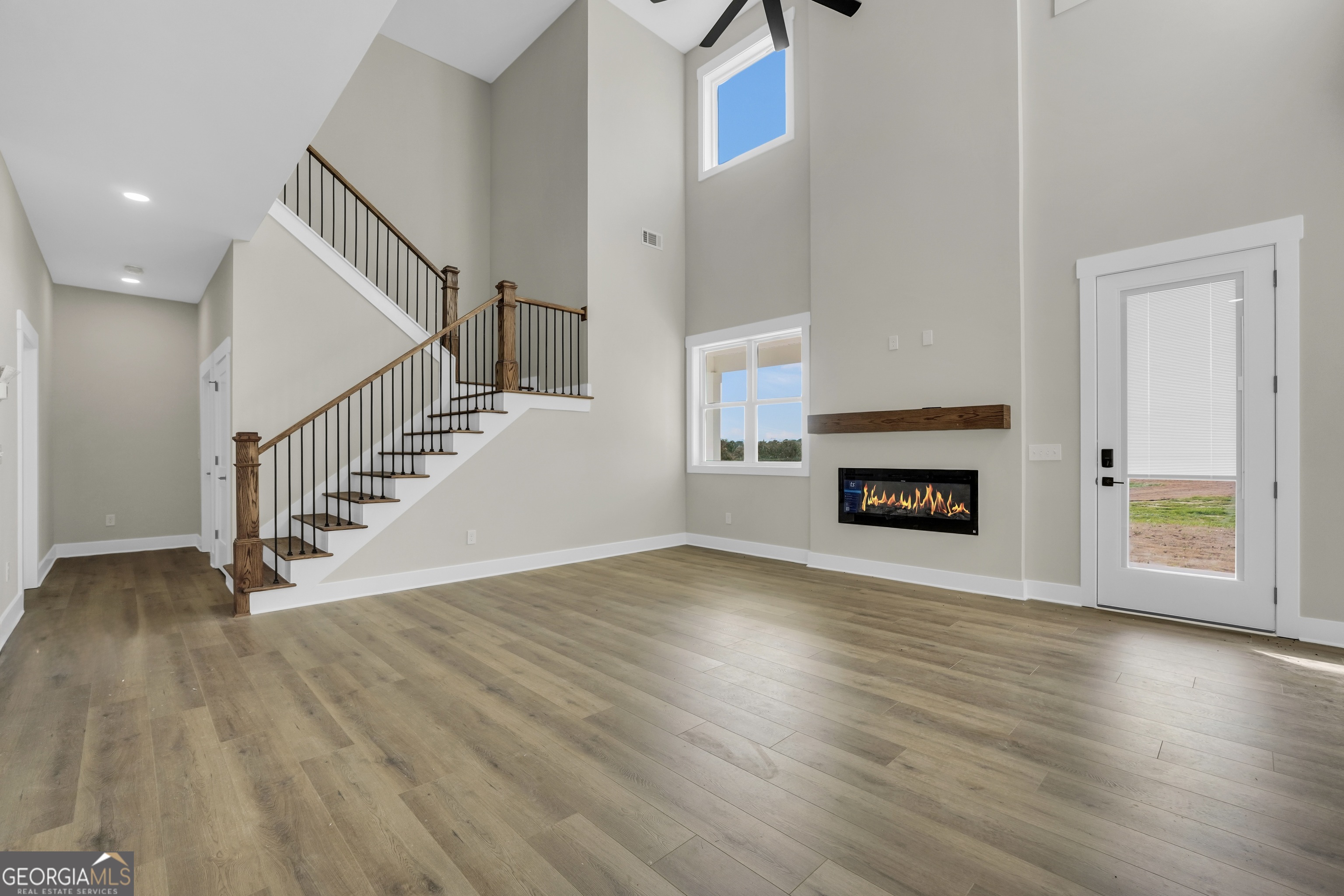 267 East Knight Road McDonough, GA 30252 - Photo 4 of 17 a view of a livingroom with wooden floor and a fireplace