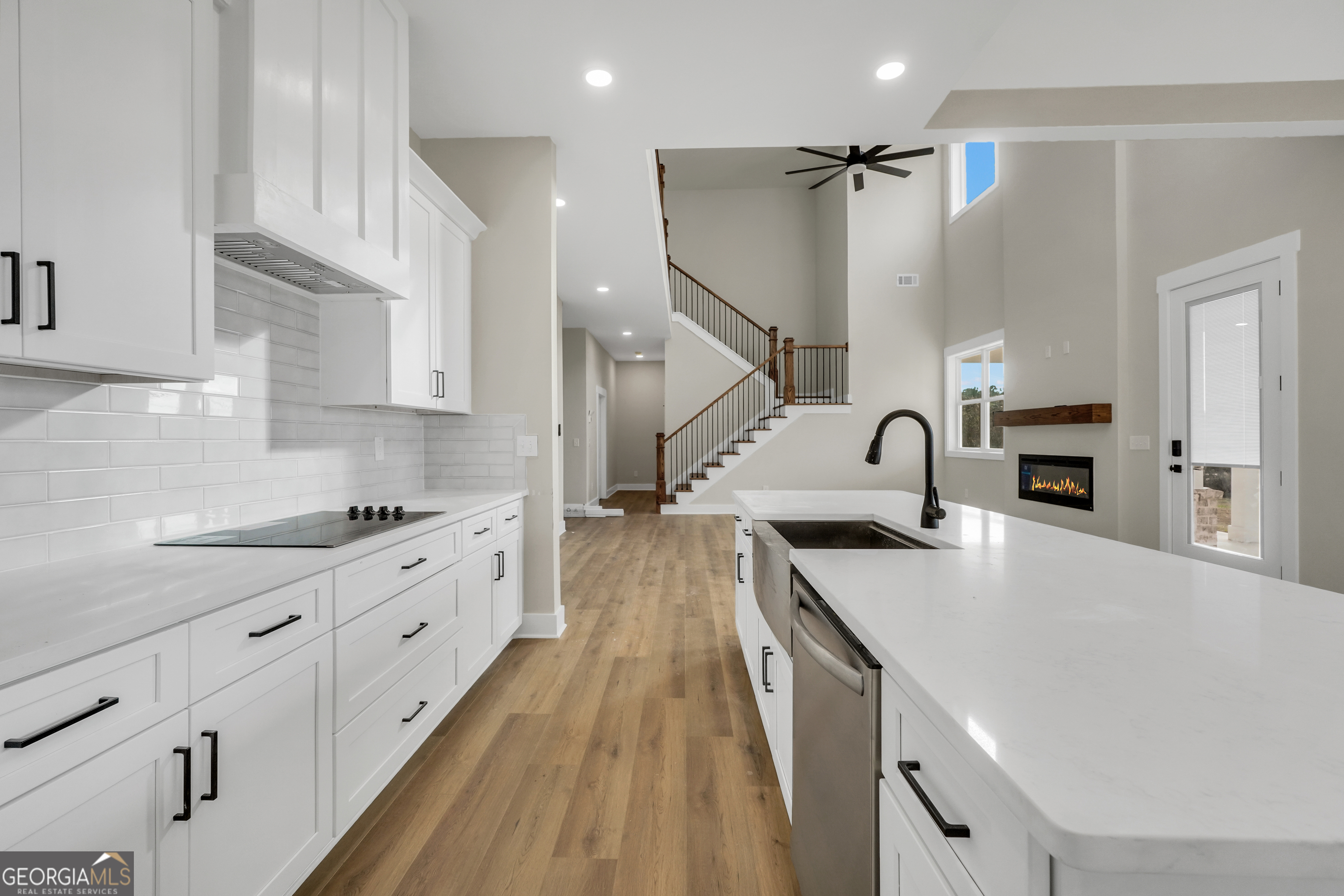 267 East Knight Road McDonough, GA 30252 - Photo 8 of 17 a kitchen with granite countertop a sink stove and refrigerator