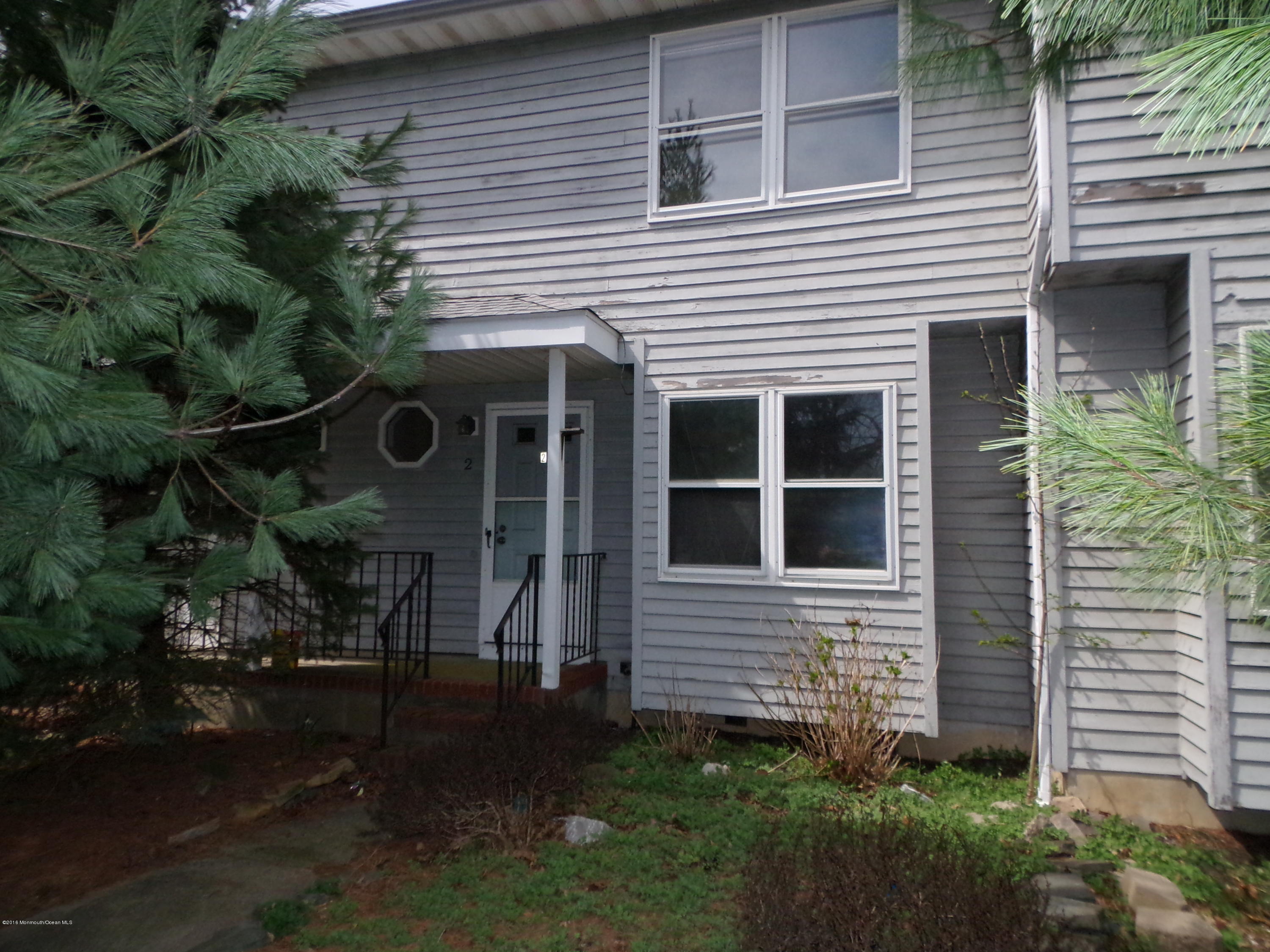 a view of house with backyard and garden