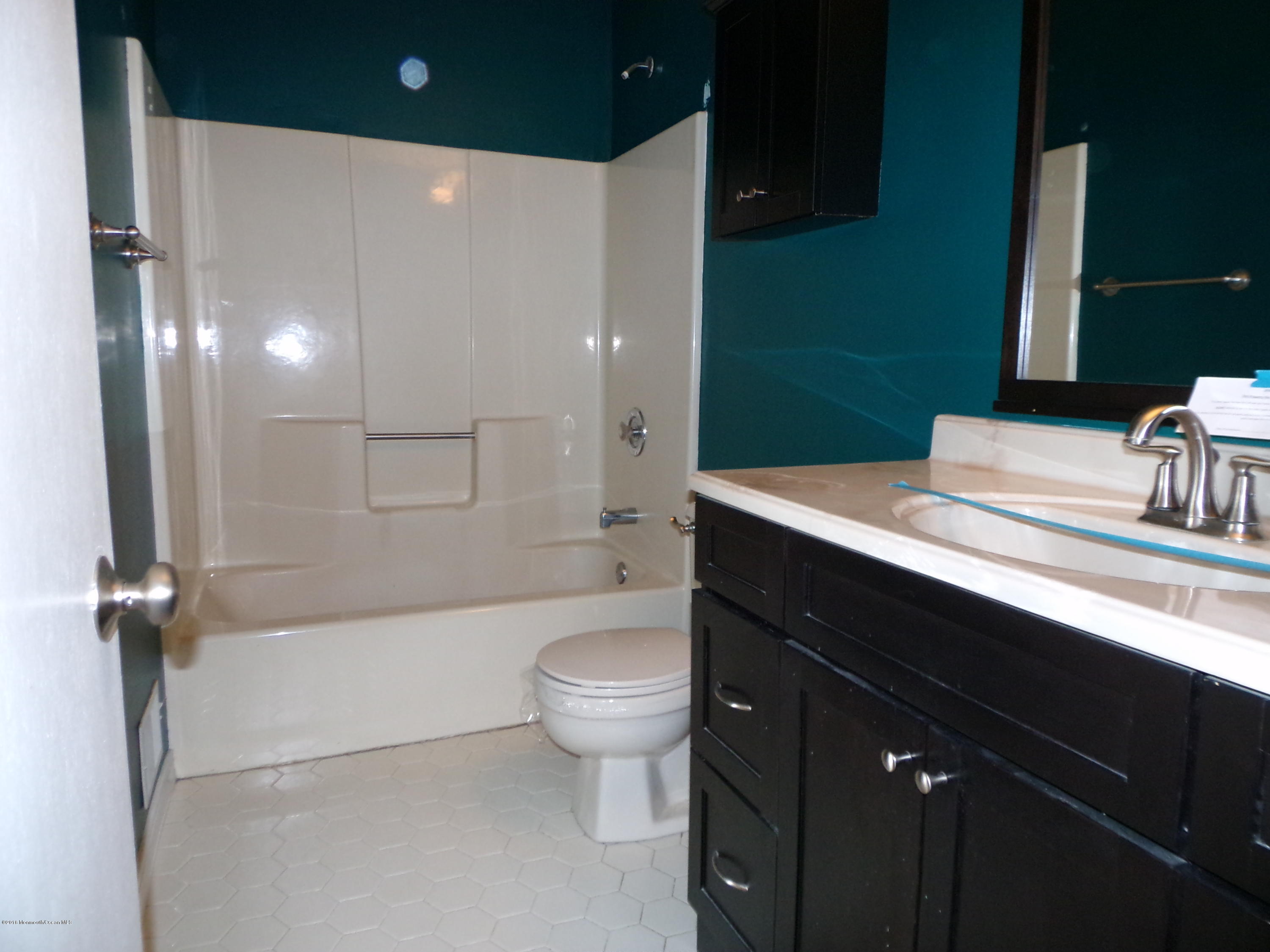 1882 Lanes Mill Road Brick, NJ 08724 - Photo 8 of 15 a bathroom with a sink a toilet and shower