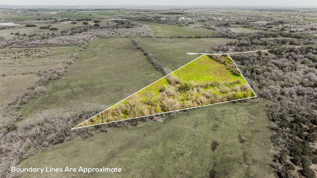 Lot 8 Ranches At Comanche Point Carlton, TX 76436 - Photo 7 of 11 an aerial view of a house with a lake
