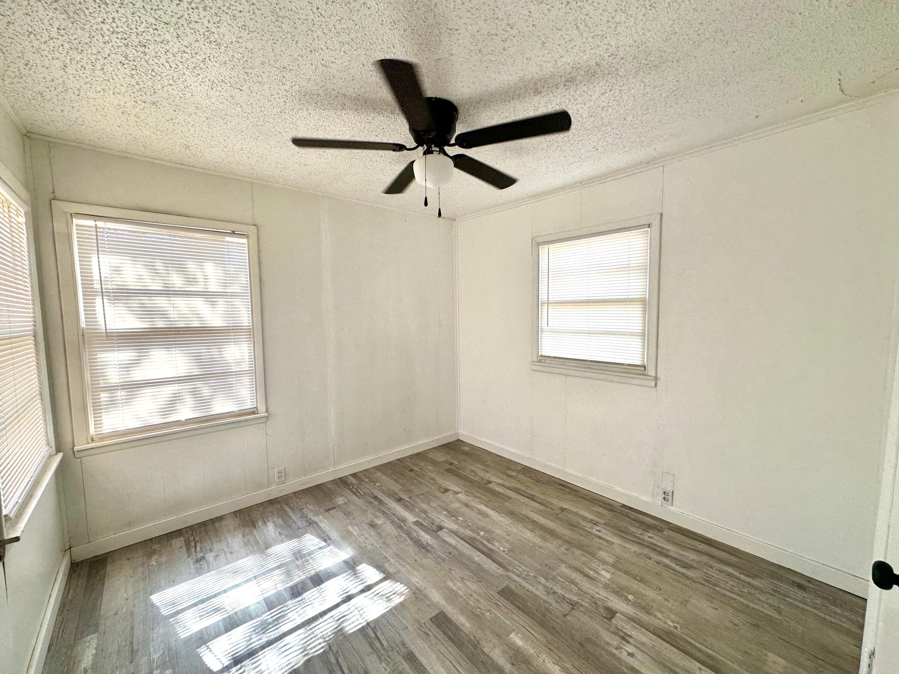 1827 8th Street Levelland, TX 79336 - Photo 12 of 25 a view of an empty room and window