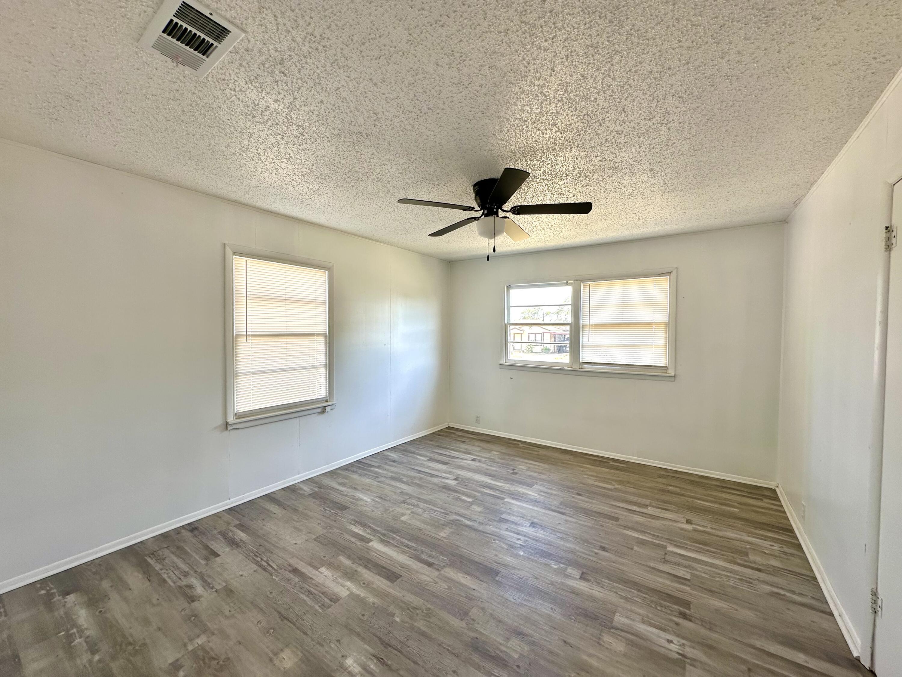 1827 8th Street Levelland, TX 79336 - Photo 20 of 25 a view of an empty room with a window